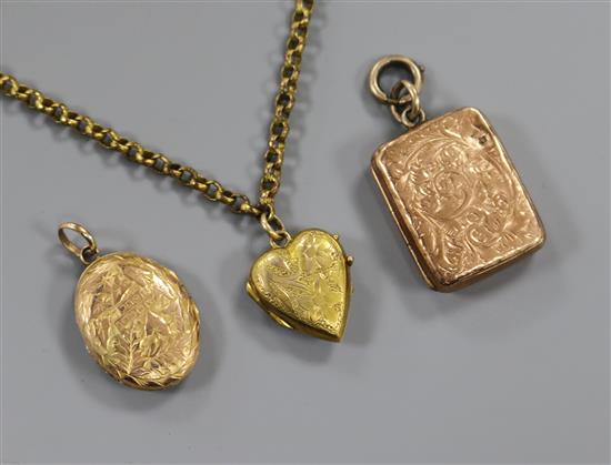 Three engraved 9ct gold lockets and a gilt metal chain.